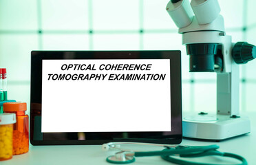 Medical tests and diagnostic procedures concept. Text on display in lab Optical Coherence Tomography Examination
