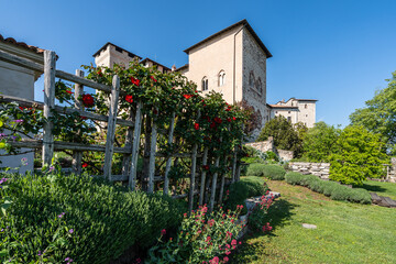 The medieval castle Rocca di Angera on the shores of the Lake Maggiore and its beautiful garden,...