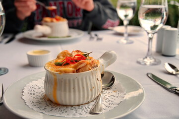 Closeup of French onion soup on the table in restaurant