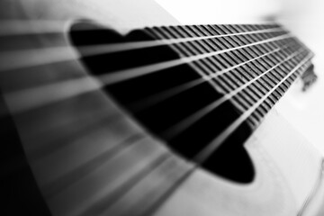 classical guitar strings and frets on white and black background - obrazy, fototapety, plakaty