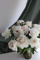  bouquet of white flowers peonies in the vase on table