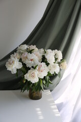  bouquet of white flowers peonies in the vase on table
