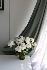  bouquet of white flowers peonies in the vase on table