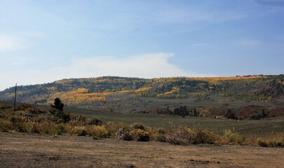 Obraz premium Fall Landscape with Trees and Hills