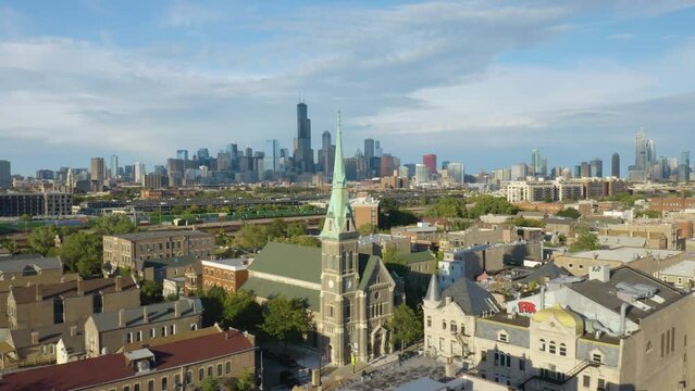 Cinematic Drone Shot Above Pilsen Neighborhood looking Downtown Chicago Skyline on Beautiful Summer Afternoon