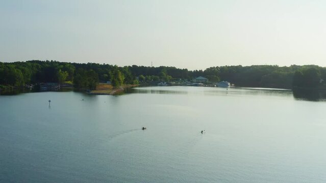 Drone Orbit Right of Two people on Kayaks on the Water of Lake Norman in Mooresville, North Carolina