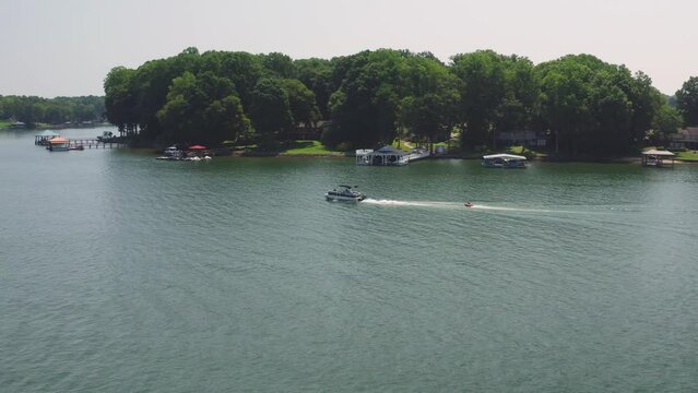 Drone Dolly Left Tracking a Boat on Lake Norman Pulling a Tube