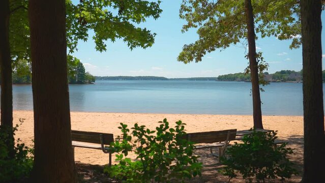 Camera Pedestal Up to Reveal Benches on Shore of Lake Norman, North Carolina
