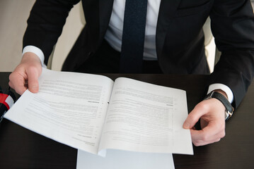 Business photo - man with a contract in his hands