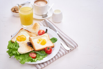 Fried Egg on Toast Bread and cup of fresh hot coffee on light grey background