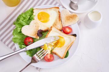 Fried Egg on Toast Bread and cup of fresh hot coffee on light grey background