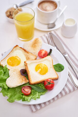 Fototapeta premium Fried Egg on Toast Bread and cup of fresh hot coffee on light grey background