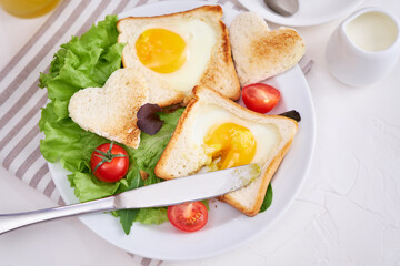 Fototapeta na wymiar Fried Egg on Toast Bread and cup of fresh hot coffee on light grey background
