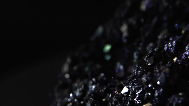 Closeup of Purple Mineral (Amethyst) in Dark Room, crystallic parts