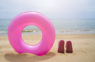 Rubber rings and baby shoes for playing in the sea.