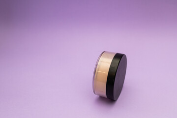 Facial Powder on Purple Background