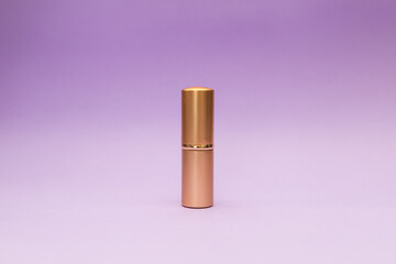 Golden tube on purple background