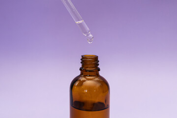 Hair serum, subject shot on purple background