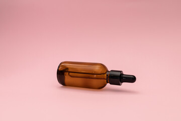 Serum in a glass jar with a pipette