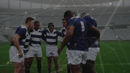 Animation of network of connections over team of diverse male rugby players discussing together - Powered by Adobe