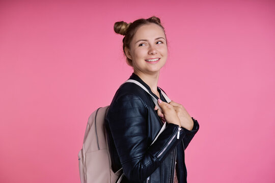 High School Student Girl Wearing Backpack And Looking Back