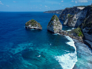 Aerial photo of Nusa Penida bay, white waves and crystal clear water