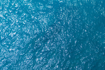 Blue surface of the ocean. Texture of the sea, background.