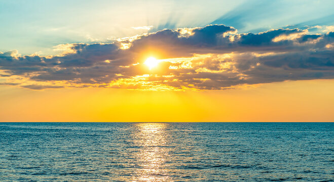 Bright sunset over the sea. Seascape in the evening.