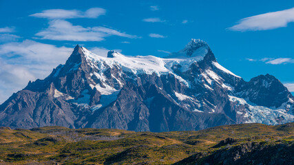 Peaks of Torres seen from Pehoe Lago with turquoise water in Torres del Paine National Park,...