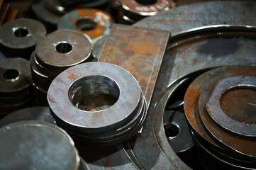 Group of workpieces cut of metal sheet in storehouse