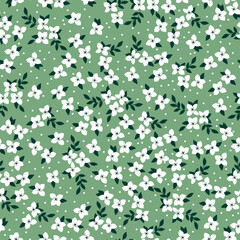 Simple vintage pattern. small white flowers and dots, dark green leaves. green background. Fashionable print for textiles and wallpaper.