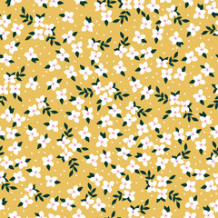 Simple vintage pattern. small white flowers and dots, dark green leaves. yellow background. Fashionable print for textiles and wallpaper.