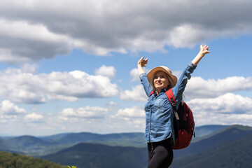 Freedom traveler woman on the top of mountains enjoy a wonderful nature. Yound girl on peak mountain with perfect view mountains. travel concept