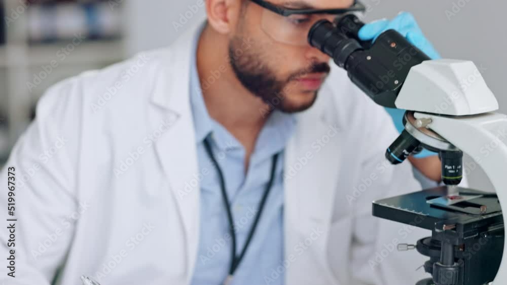 Poster scientist, research analyst or medical engineer looking through a microscope and recording his findi