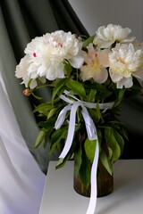  bouquet of white flowers peonies in the vase on table