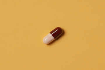 Medical pills on yellow background. Health care, pharmacy, drugs, medicine concept. Copy space for text.
