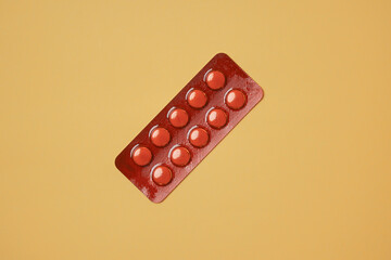 Medical pills on yellow background. Health care, pharmacy, drugs, medicine concept. Copy space for text.