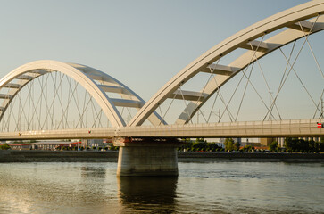 Novi Sad, Serbia. July - 25. 2022. Zezelj bridge on river Danube in Novi Sad. View of the Zezelje Bridge on the Danube in Novi Sad from the Petrovaradin side in the summer and in the afternoon.