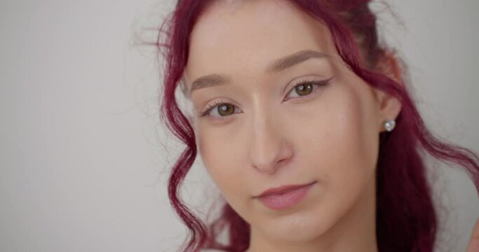 Beautiful redhead woman's face in medium shot, skincare concept