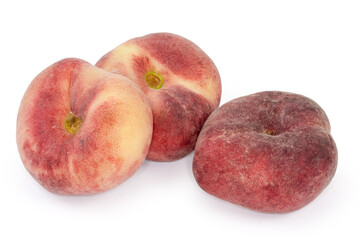Flat peaches close-up on a white background