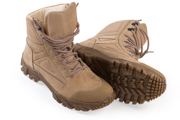 Pair of beige leather summer combat boots on white background