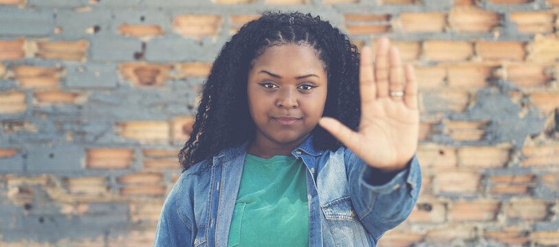 Confident african american woman gesturing stop