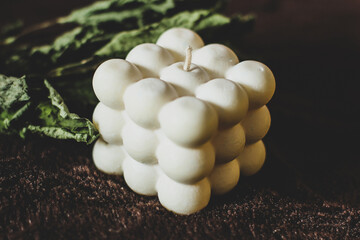 Candle cube from spheres. Fashion candle design