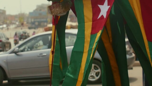 Slow Motion Shot of an array of Republic of Togo Flags in the street
