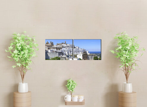 2-part wall canvas to decorate a living room wall with sofa. The canvas is a panorama of the Amalfi harbour. Italy
