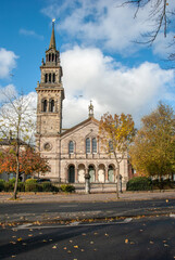 Fototapeta premium Italianate building of the former Elmwood Presbyterian Church with a spire on top of a campanile, Renaissance arcade and chunky Venetian columns on University Road in Belfast, Northern Ireland, UK