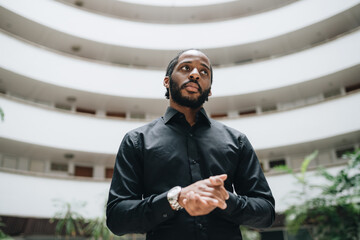 Portrait of black man in a hall in a condo