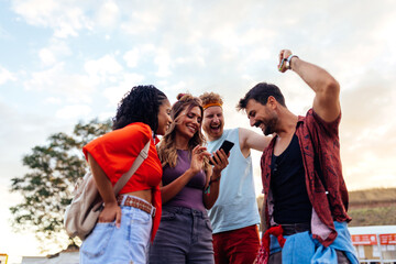 Four festival people using phone