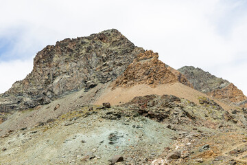 Excursion to the Gran Paradiso in the Alps. Search for rocks, minerals and precious stones. Study of the surface of rocks with sedimented debris over time. Lunar landscape, Martian landscape.