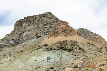 Excursion to the Gran Paradiso in the Alps. Search for rocks, minerals and precious stones. Study of the surface of rocks with sedimented debris over time. Lunar landscape, Martian landscape.